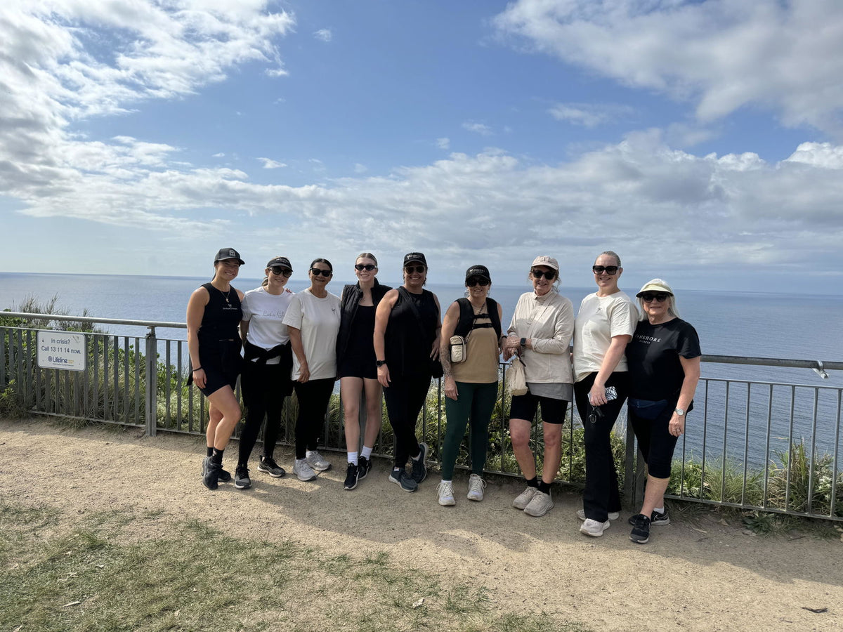 Group of women on a coastal walk, all wearing RUKVESTs